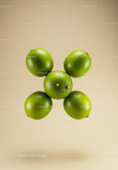 Fresh green limes arranged in flower shape on beige background