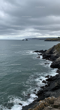 Misty Ocean Coastline with Rocky Cliffs and Stormy Sky