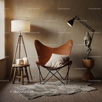 Cozy reading nook with leather butterfly chair and warm lighting