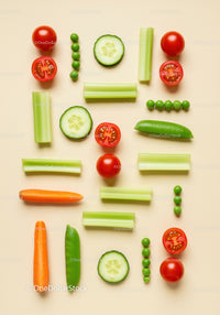 Fresh vegetables arranged in geometric pattern on beige