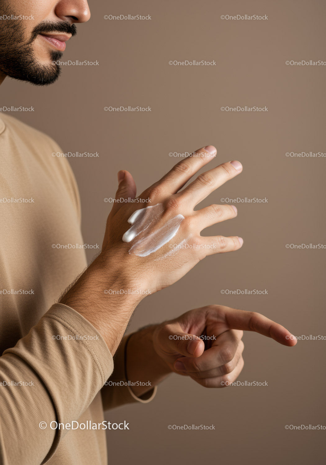 Close-Up of a Man Applying Lotion to Hands for Skin Care