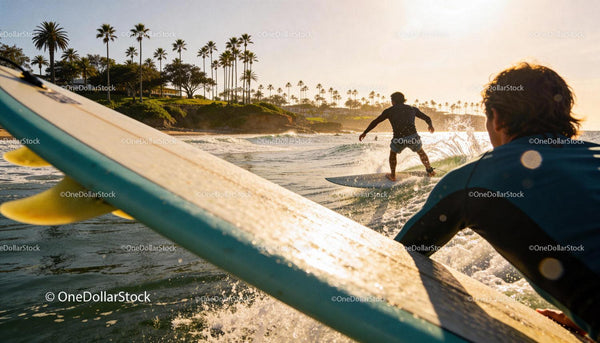 Surfers catching waves on a sunny coastal beach