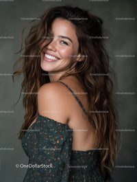 Joyful Young Woman with Wavy Hair Smiling in Studio Portrait