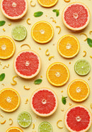 Fresh citrus fruit slices with mint leaves on yellow