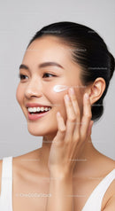 Young Woman Applying Skincare Moisturizer for Healthy Glowing Skin