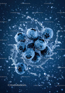 Fresh blueberries splashing in clear water closeup