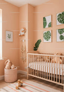 Cute Nursery Room with Green Monstera Wall Art and Plush Teddy Bears
