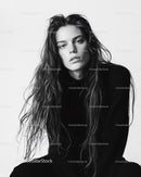 Stylish Black and White Portrait of a Young Woman with Wavy Hair