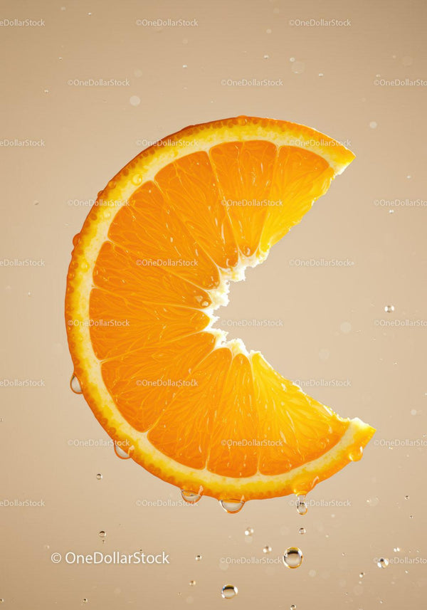 Fresh orange slice with water droplets on beige background