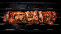 Juicy grilled chicken skewers with onion on barbecue