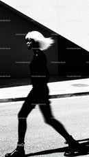 Silhouette of Woman with Flowing Hair in Urban Light