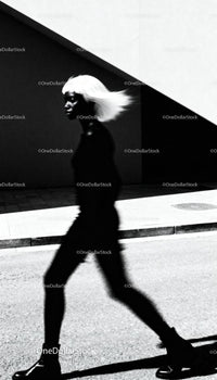 Silhouette of Woman with Flowing Hair in Urban Light