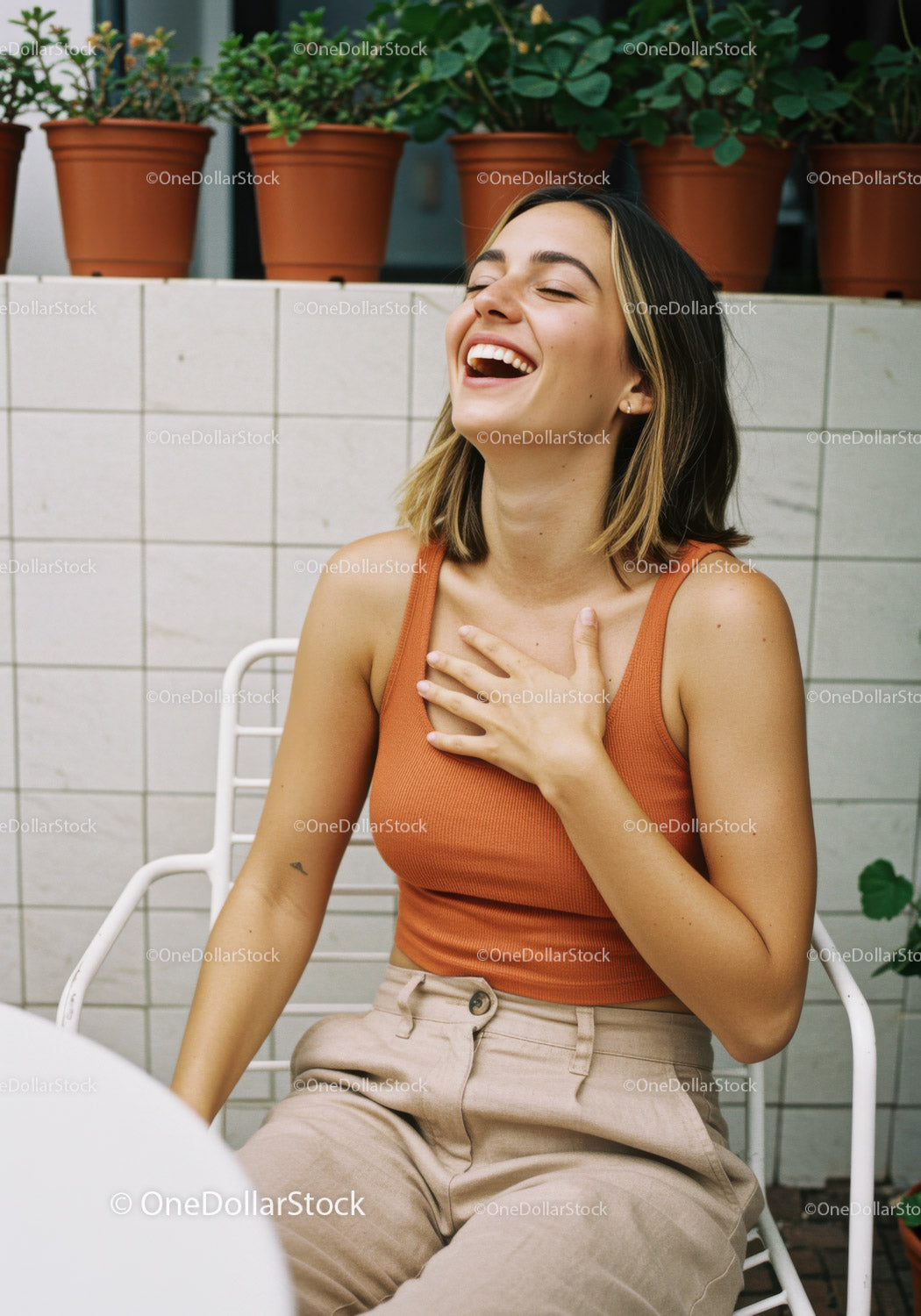 Joyful Young Woman Laughing Outdoors in Casual Summer Attire
