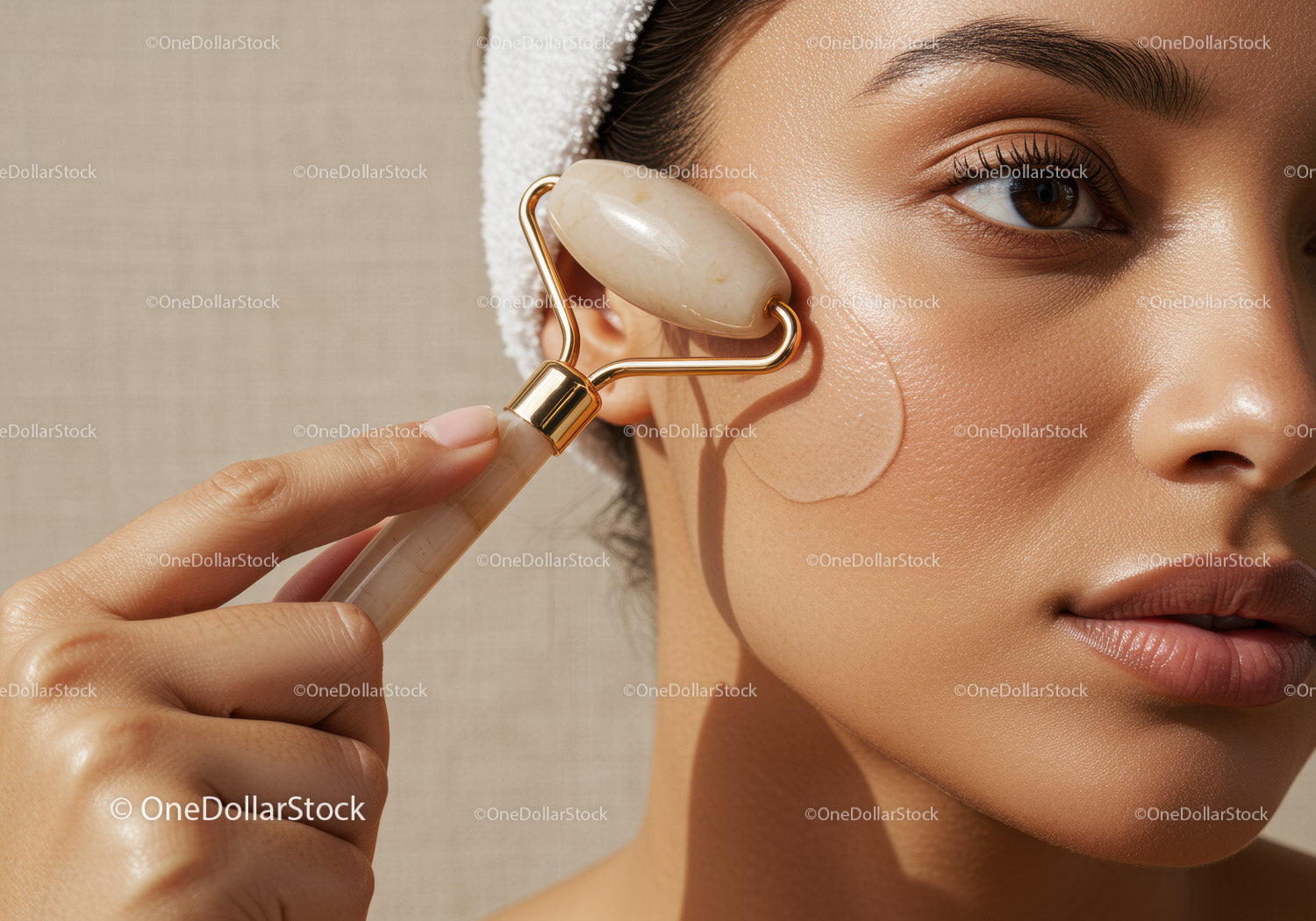 Close-up of Woman Using Jade Roller for Facial Skincare
