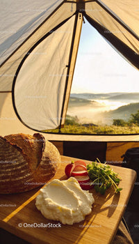 Fresh rustic bread and spread with radishes in tent