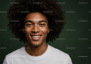 Smiling Young Man with Curly Hair and Bright Expression
