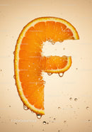 Fresh orange slice with water droplets close up