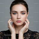 Elegant Woman with Blue Eyes and Clear Skin in Studio