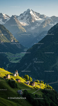 Majestic Snow-Capped Mountain Range with Green Valley and Alpine Village