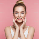 Portrait of a Smiling Blonde Woman with Clear Skin on Pink Background