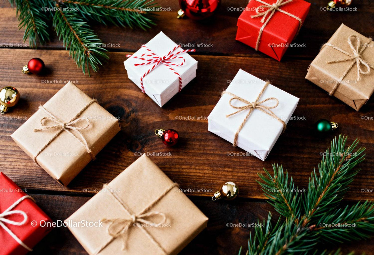Holiday Gift Boxes with Pine Branches on Wooden Table