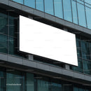 Large blank billboard on modern glass office building