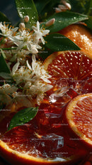 Sliced Blood Oranges with Ice Cubes and Green Leaves