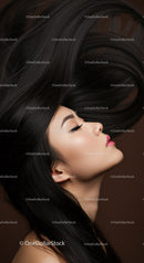 Side profile of woman with flowing dark hair and closed eyes