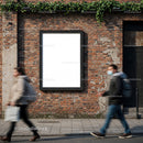 Urban street scene with blank billboard on brick wall