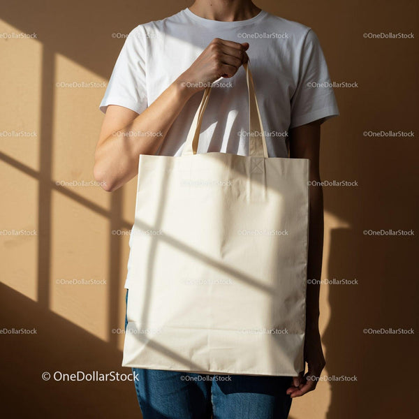 Person holding blank natural cotton tote bag JPG Mockup Image