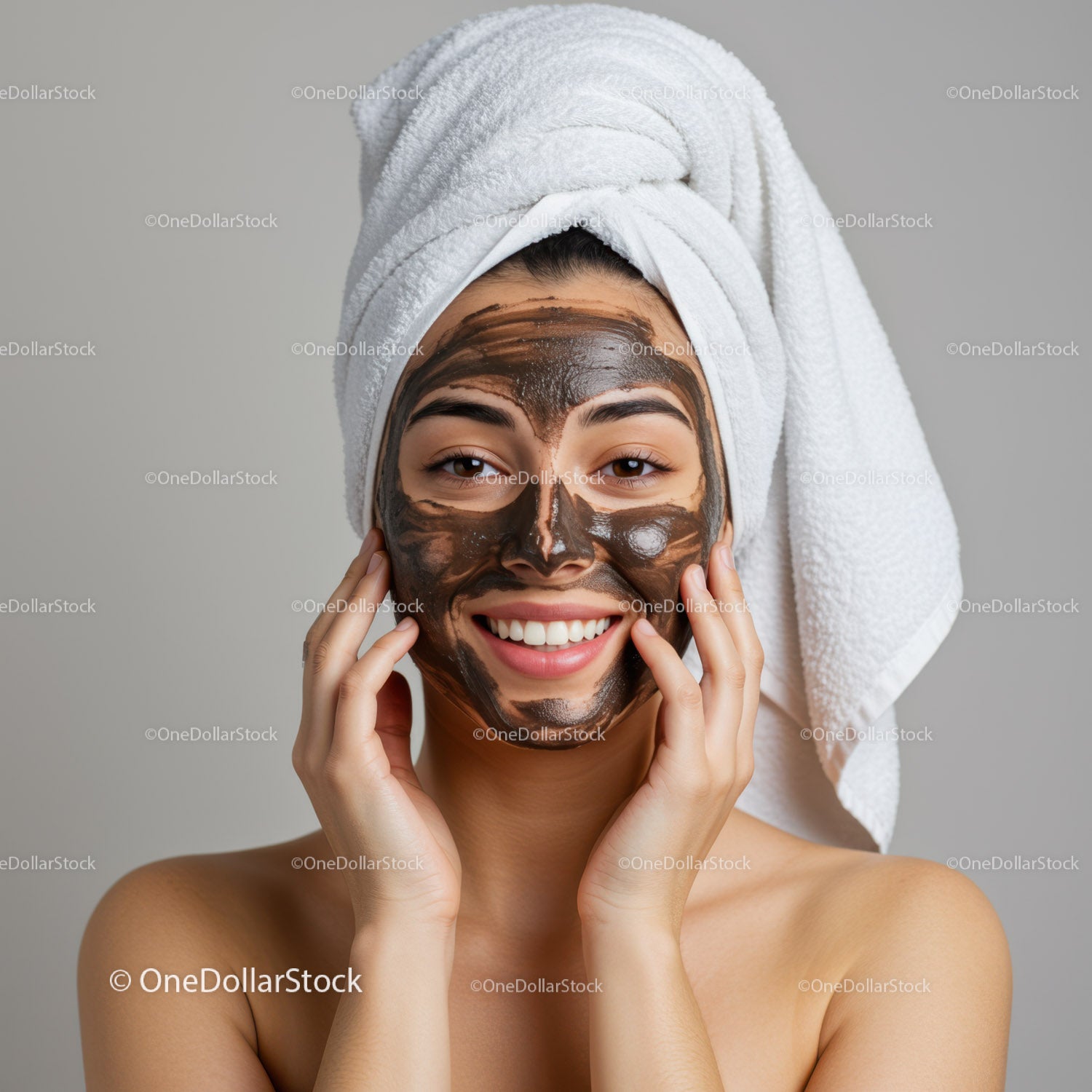 Young Woman Applying Black Face Mask with Towel on Head