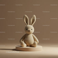 Soft Plush Bunny Sitting on Round Pedestal in Warm Light