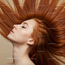 Serene woman with flowing red hair in profile view