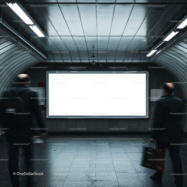 Blurred commuters passing empty illuminated billboard in subway JPG Mockup Image