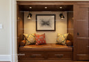 Warm Cozy Built-in Bench with Decorative Pillows and Modern Wall Art