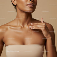 Close-up of Woman Applying Moisturizer Showcasing Healthy Glowing Skin