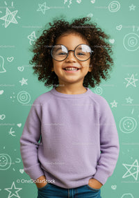 Smiling child with curly hair wearing round glasses