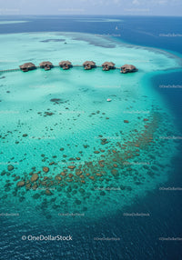 Overwater Bungalows on Vibrant Turquoise Reef with Scenic Ocean View