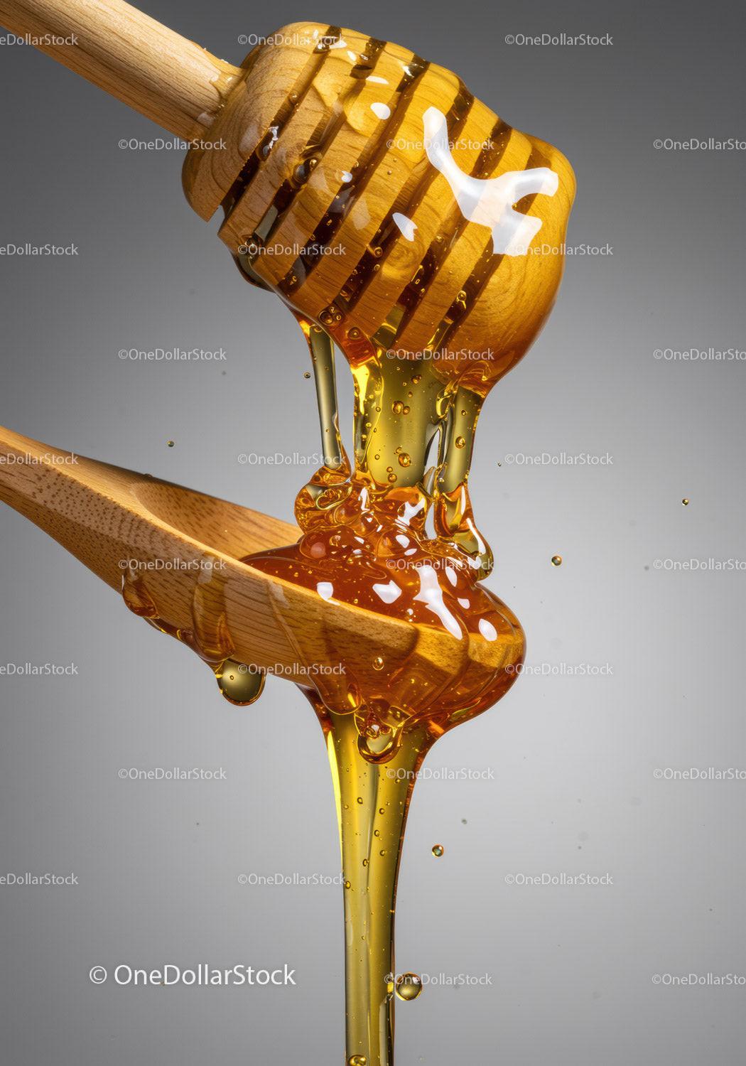 Golden honey flowing from wooden dipper to spoon