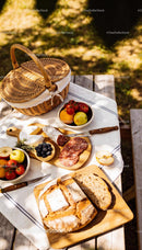 Rustic Picnic Spread with Bread, Cheese, and Fresh Fruit