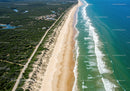 Scenic Coastal Beach with Turquoise Waters and Lush Vegetation