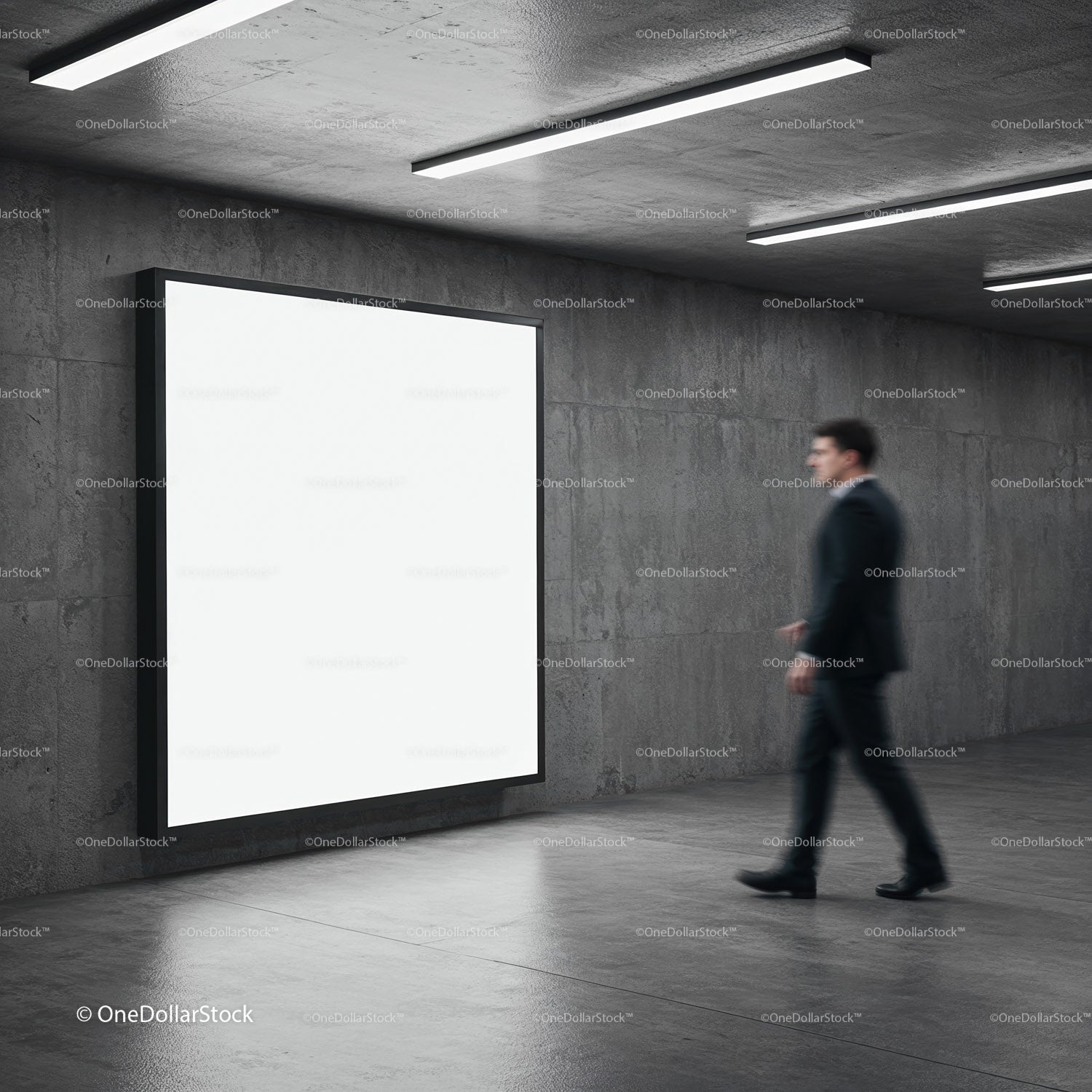 Businessman Walking Past Illuminated Blank Billboard in Modern Corridor