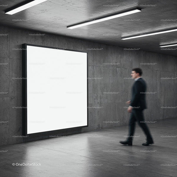 Businessman Walking Past Illuminated Blank Billboard in Modern Corridor JPG Mockup Image