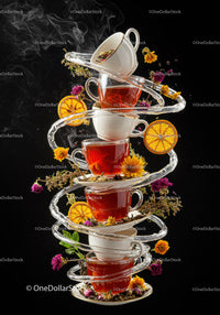 Stack of Teacups with Spiraled Water and Floating Herbs