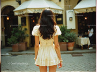 Woman in Yellow Dress Walking on City Street During Day