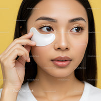 Young Woman Applying Under Eye Mask for Skin Rejuvenation