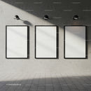 Three Blank Vertical Frames on Concrete Wall with Lamps