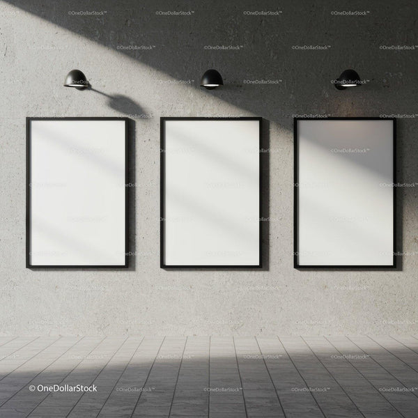 Three Blank Vertical Frames on Concrete Wall with Lamps JPG Mockup Image