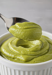 Creamy Avocado Dip in White Ceramic Bowl with Spoon