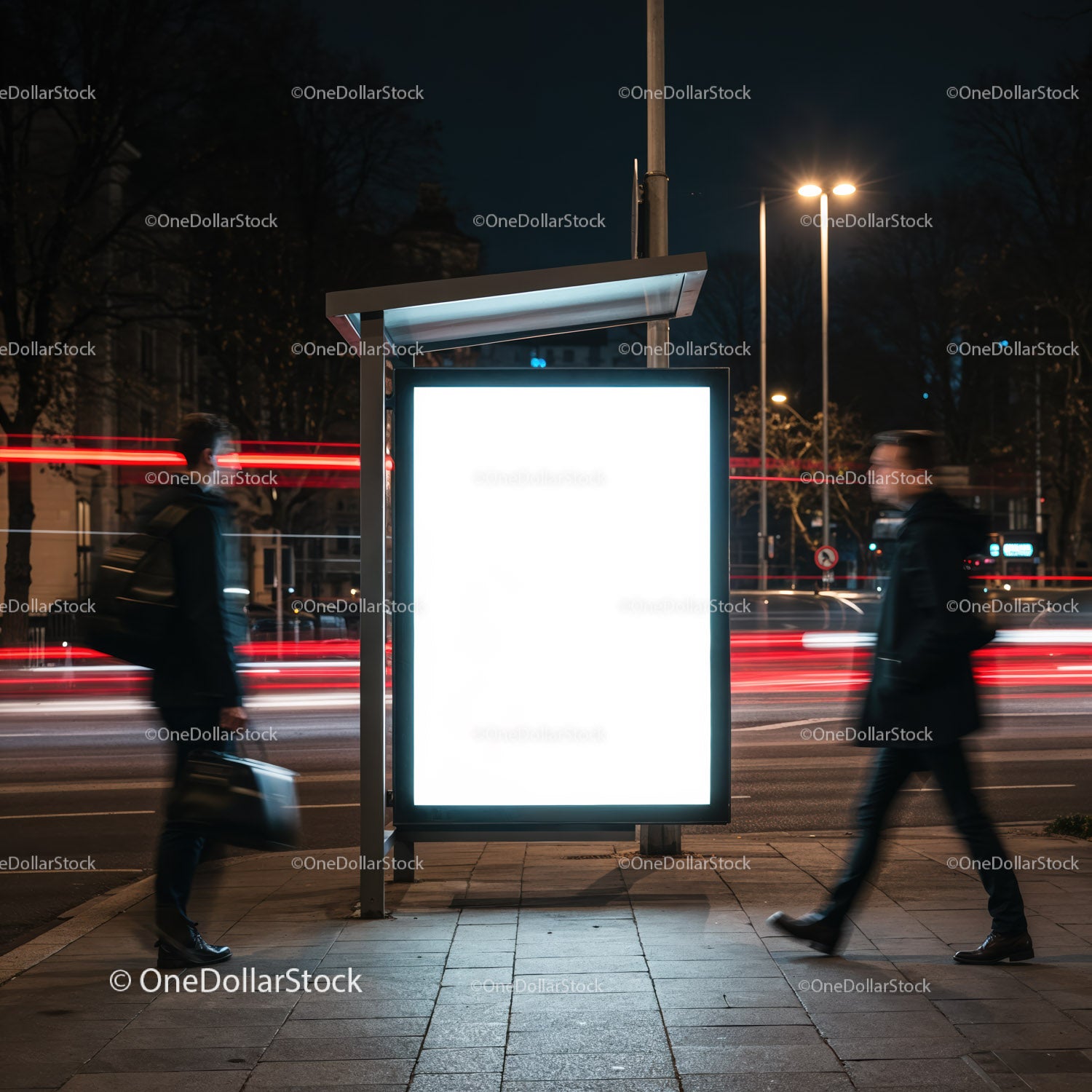 Illuminated urban bus stop sign glowing at night
